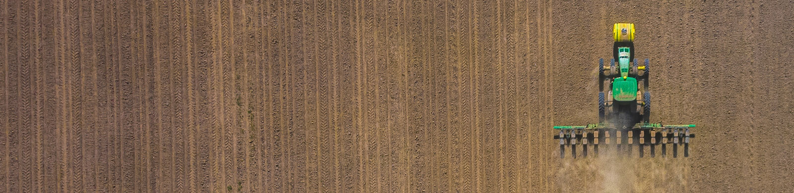 Tractor plowing field